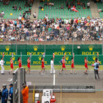 Car numbers held aloft on the way to the grid for the grid walk.