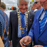 I'd be delighted if anyone can confirm who this 'mayoral' figure is wearing an FIA livery collar!