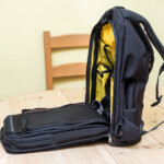 Don't forget the shoulder straps have to be pushed forward and out of the way for unhindered access.