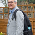 This view shows the side profile of the bag containing a laptop, a mirrorless camera with standard zoom, plus a medium telephoto and a portrait prime lens, as well as a flash unit in the top compartment and a wallet in the 'lumbar' compartment. There is still space left for other items, if necessary.